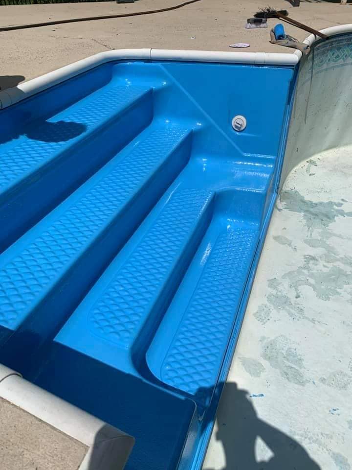 Newly painted blue pool steps