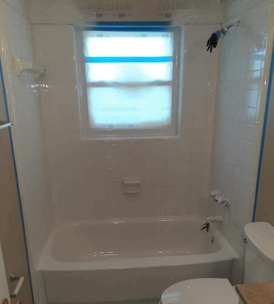 Clean white finished bathroom tub after reglaze